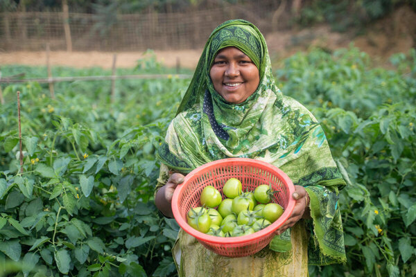 With WFP's support Farida, a member of the Goalmarha Matamuhuri Women’s Group, established a resilient garden, improved harvests, and increased her income. WFP/Rawful Alam