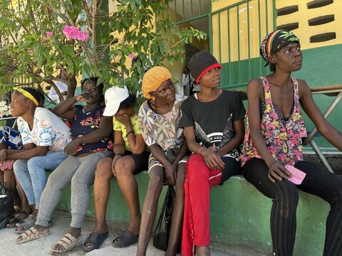 Women in Port-au-Prince Haiti wait for food assistance in Cite Soleil