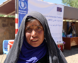 Woman at a distribution point in Afghanistan