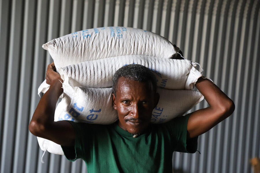Offloading of WFP food at Hitsats IDP camp Tigray following the resumption of food aid distribution in Ethiopia &nbsp;Tigray region after WFP and partners set a digital controlling mechanism by digitally registering members of the community who are found to be eligible for food assistance during the vulnerability based targeting process. The Head of Household presents a QR code which is scanned by an enumerator who then takes their household data and photo and uploads it to the MODA system. Digital registration 