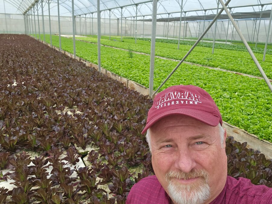 Doug Keesling, here in front of greenhouses in the Dominican Republic, became involved in food aid 25 years ago. Photo: Doug Keesling