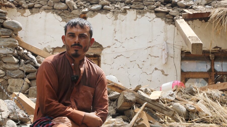 An Afghan man sitting amid the debris of his earthquake hit house. Photo: WFP/Arete